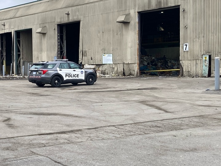 Police say investigators are working to determine the identity of the man whose body was discovered at a waste-management facility.