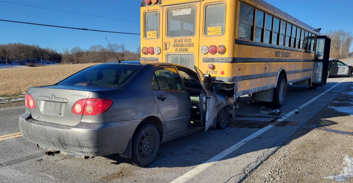 OPP have charged one driver and are looking for the driver of a second vehicle after a crash involving a school bus on Highway 15 Monday morning.