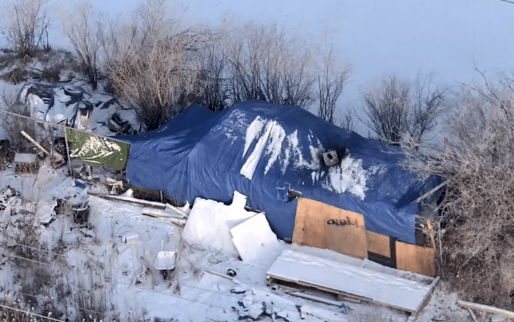 Calgary police remove homeless encampment after complaints of violence