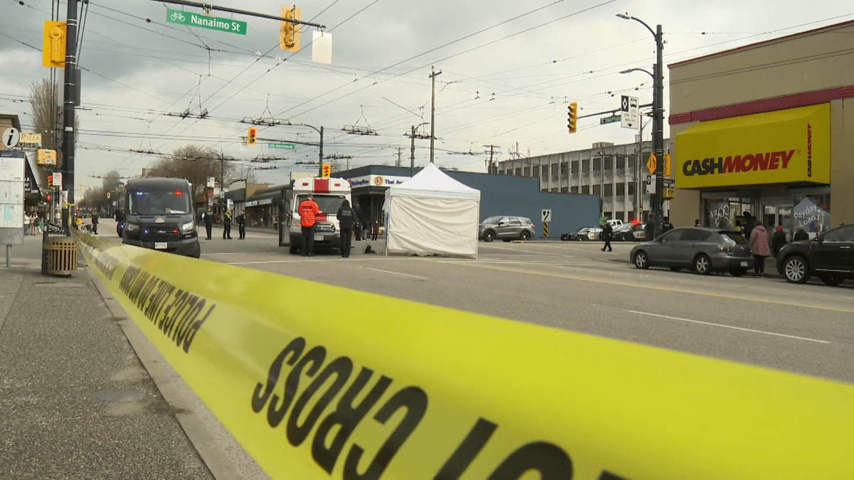 Emergency crews at the scene of a fatal hit-and-run in East Vancouver on Wednesday. 