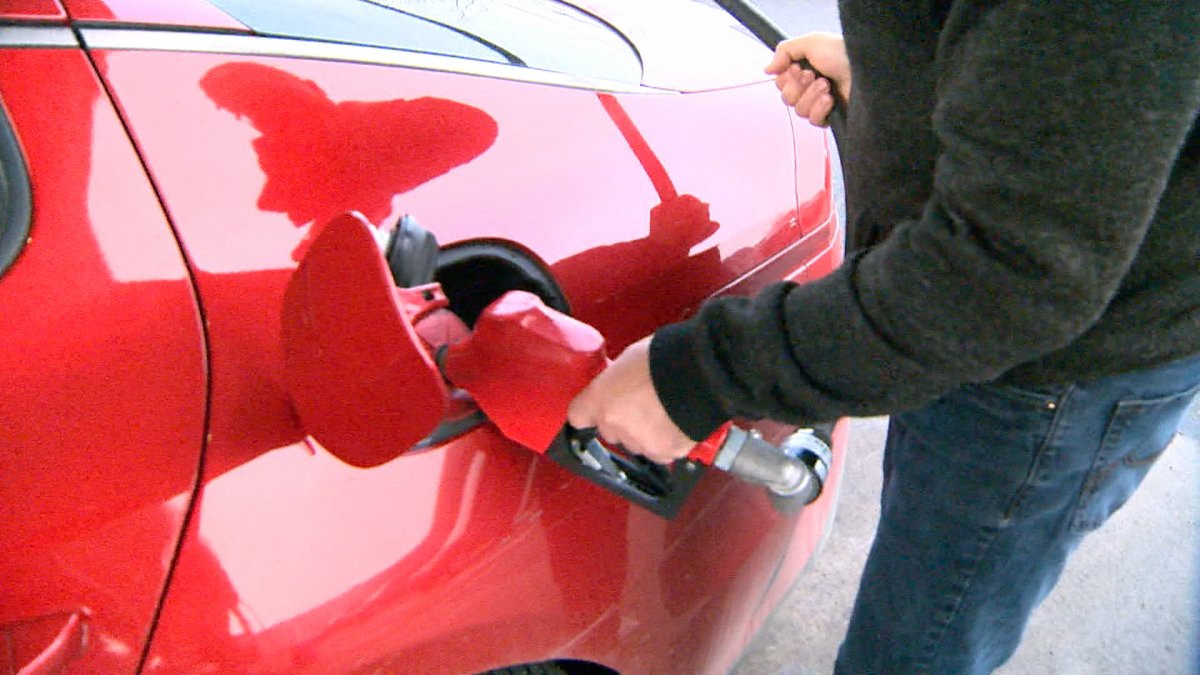 A motorist in Calgary fills his car up with gas.
