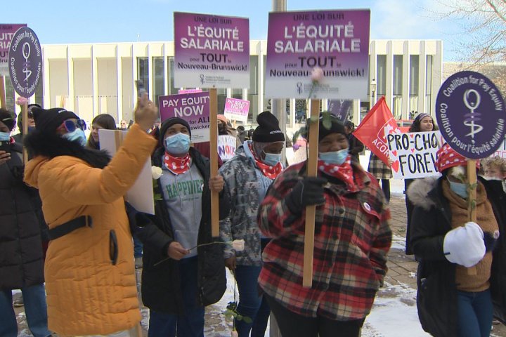 ‘A lot of work to do’: International Women’s Day march in Fredericton calls for pay equity