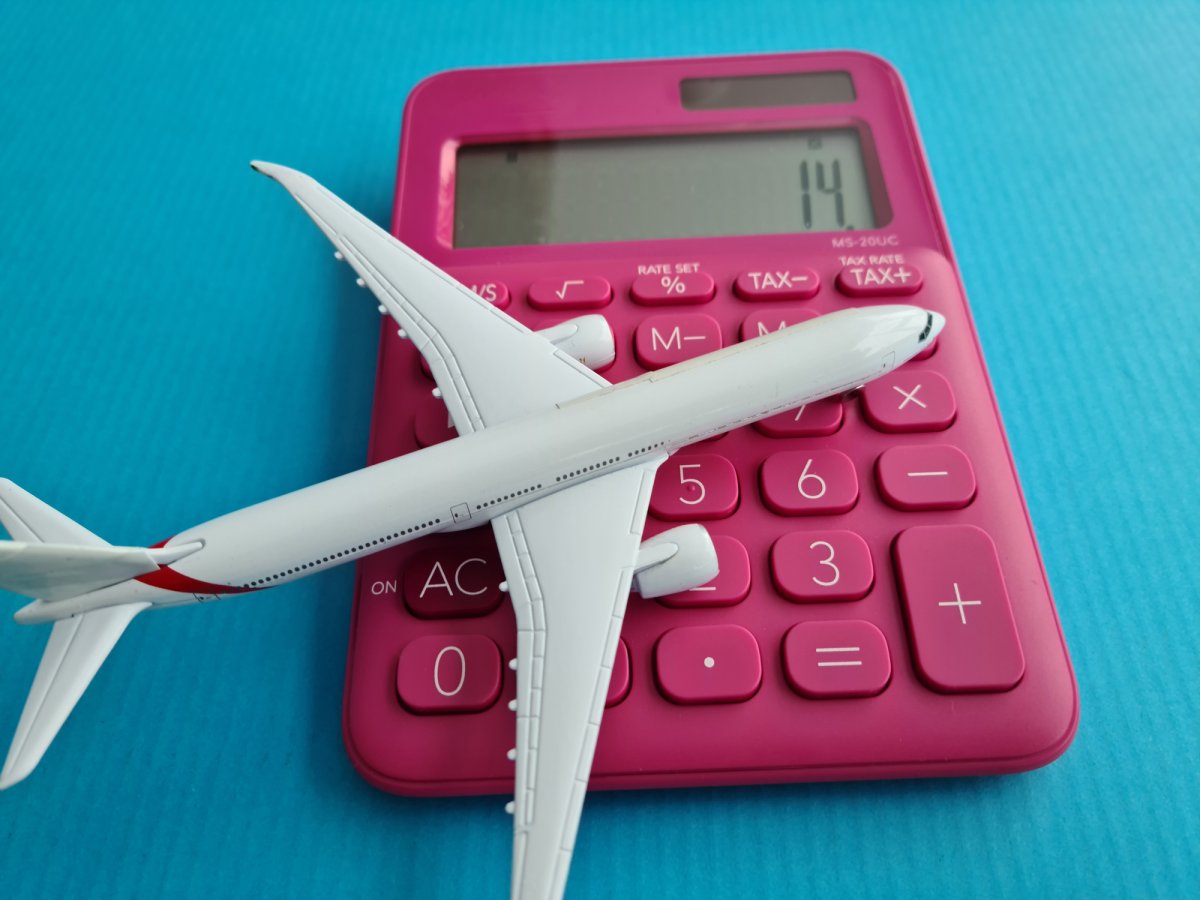 Travel calculator and airplane airfare calculation closeup