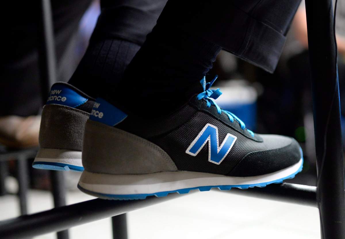 Finance Minister Joe Oliver sports his New Balance budget shoes on budget day on Parliament Hill in Ottawa on Tuesday, April 21, 2015.