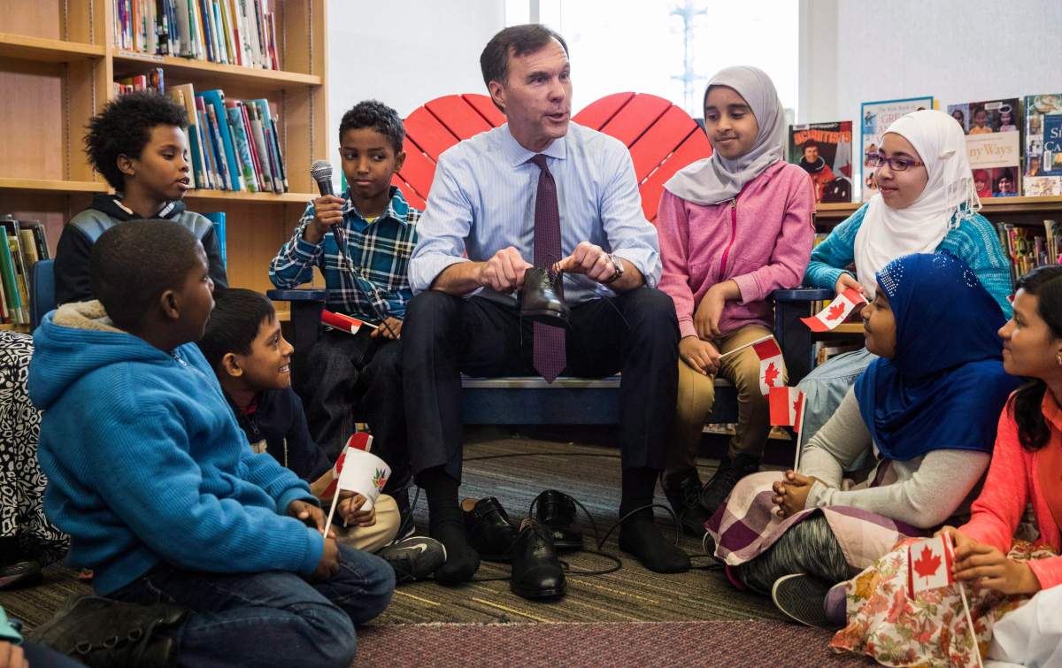 Canada’s federal Finance Minister Bill Morneau takes part in the pre-budget ceremony of putting on new shoes at the Nelson Mandela Park Public School in Toronto, Monday, March 20, 2017. THE CANADIAN PRESS/Mark Blinch