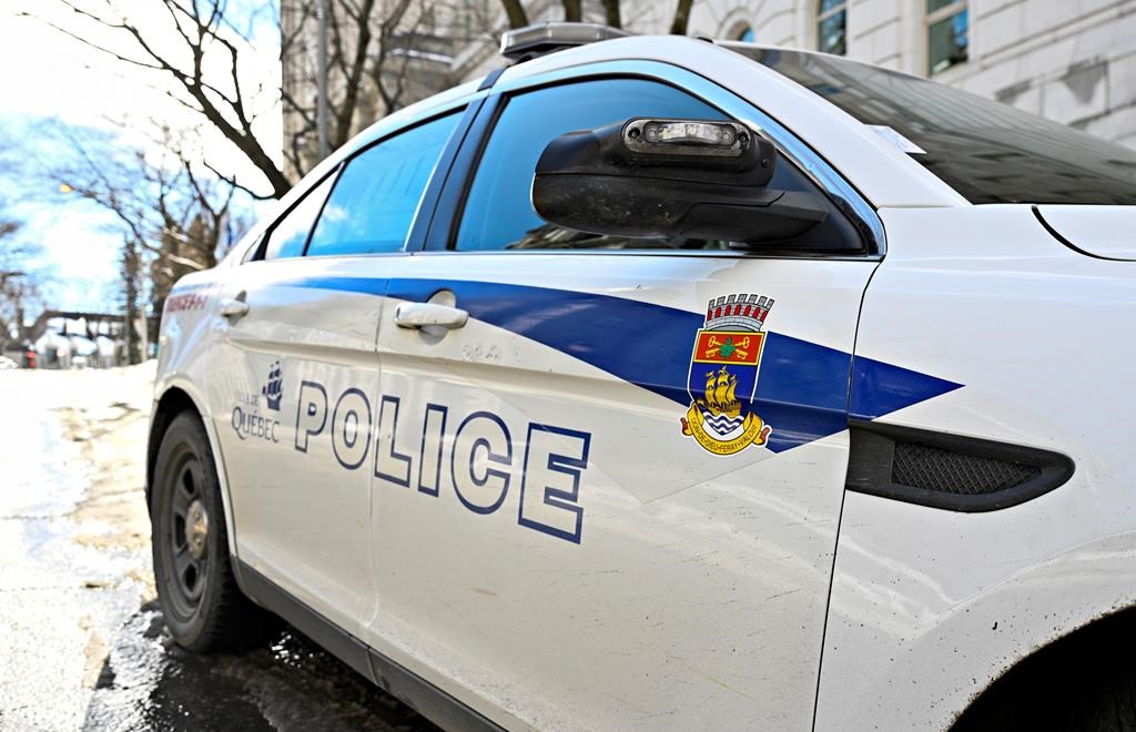 <p>A Quebec City police patrol car in Quebec City on Tuesday, March 12, 2024. The Crown says two people have been charged in the killing of a 14-month old girl last month at a home daycare in Quebec City. THE CANADIAN PRESS/Jacques Boissinot</p>.