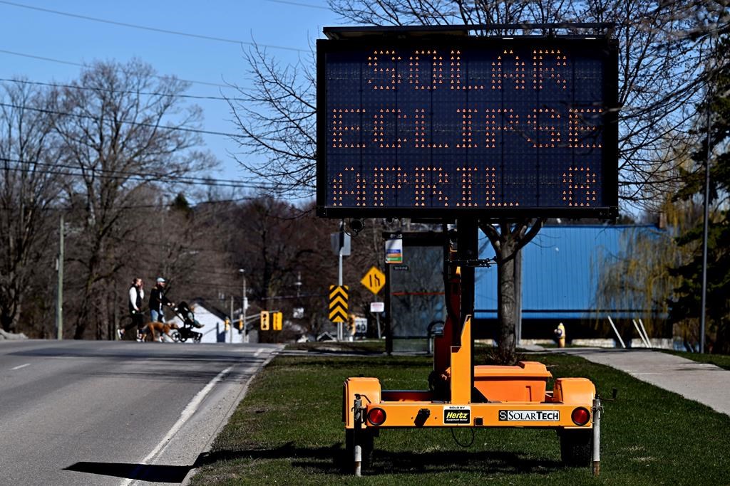 The rotating message on a digital signboard advises people to expect traffic delays, a day before a total solar eclipse will be visible in Kingston.