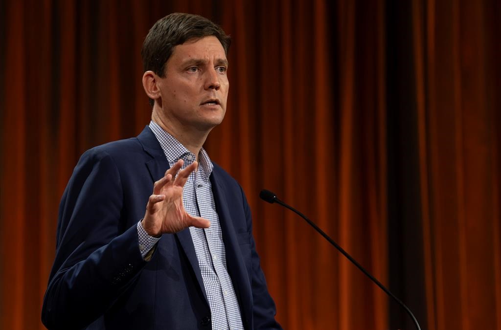 British Columbia Premier David Eby speaks at the NDP Convention in Hamilton, Ont., on Friday, October 13, 2023. The British Columbia government has introduced legislation that it says will put in place 20-metre access zones around schools to protect students from disruptive behaviour, including aggressive protests. THE CANADIAN PRESS/Peter Power .