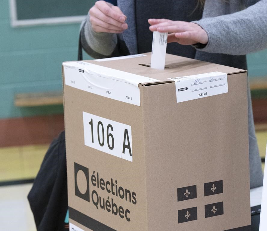 A voter casts their ballot in the Quebec provincial election, Monday, Oct. 3, 2022, in Montreal. Quebec's election czar has cancelled a pilot project to test internet voting during the 2025 municipal elections. THE CANADIAN PRESS/Ryan Remiorz.