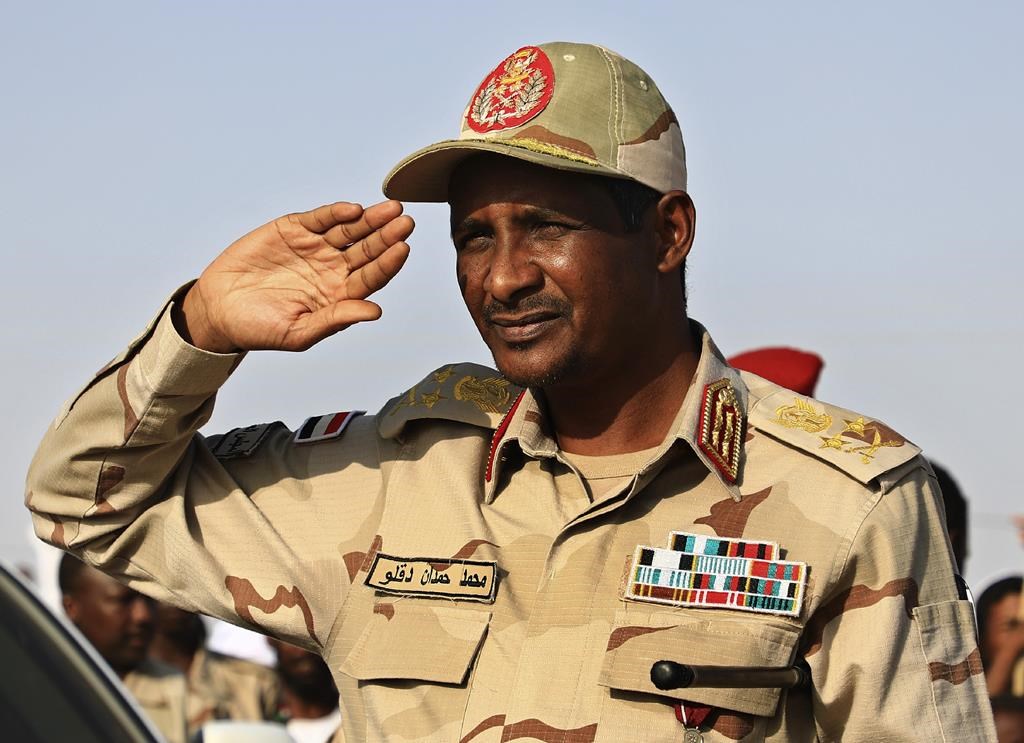 FILE – Gen. Mohammed Hamdan Dagalo, then deputy head of the military council, salutes during a rally, in Galawee, northern Sudan, June 15, 2019. Sudan has been torn by war for a year now, torn by fighting between the military and the notorious paramilitary Rapid Support Forces. (AP Photo, File)