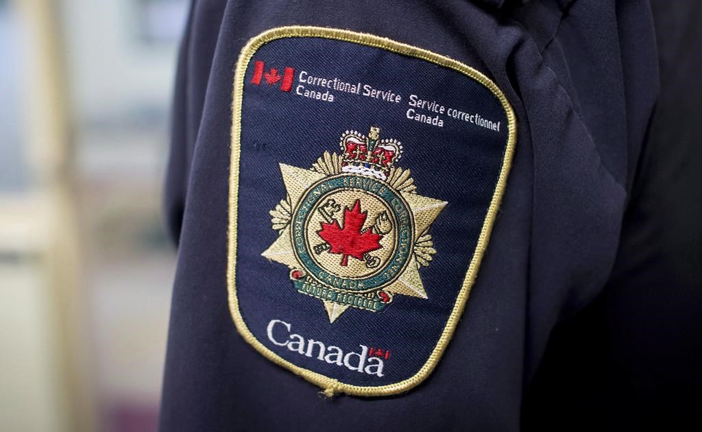 A Correctional Service of Canada patch is seen on the arm of a corrections officer in Abbotsford, B.C., on Thursday, October 26, 2017. The Correctional Service of Canada is confirming that the inmate who briefly escaped from a New Brunswick prison on the weekend was Jermaine Carvery, a career criminal known for terrorizing robbery victims and attempting to flee custody. THE CANADIAN PRESS/Darryl Dyck.