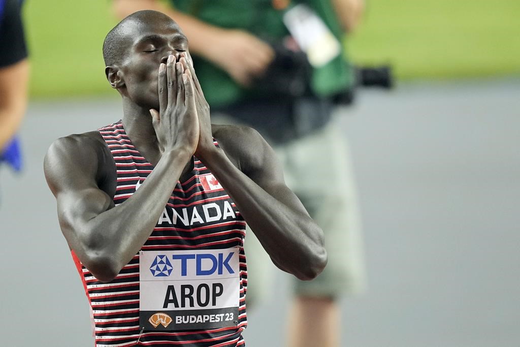 Marco Arop of Canada celebrates winning the gold medal ahead in the Men's 800-meters final during the World Athletics Championships in Budapest, Hungary, Saturday, Aug. 26, 2023. THE CANADIAN PRESS/AP-Martin Meissner.