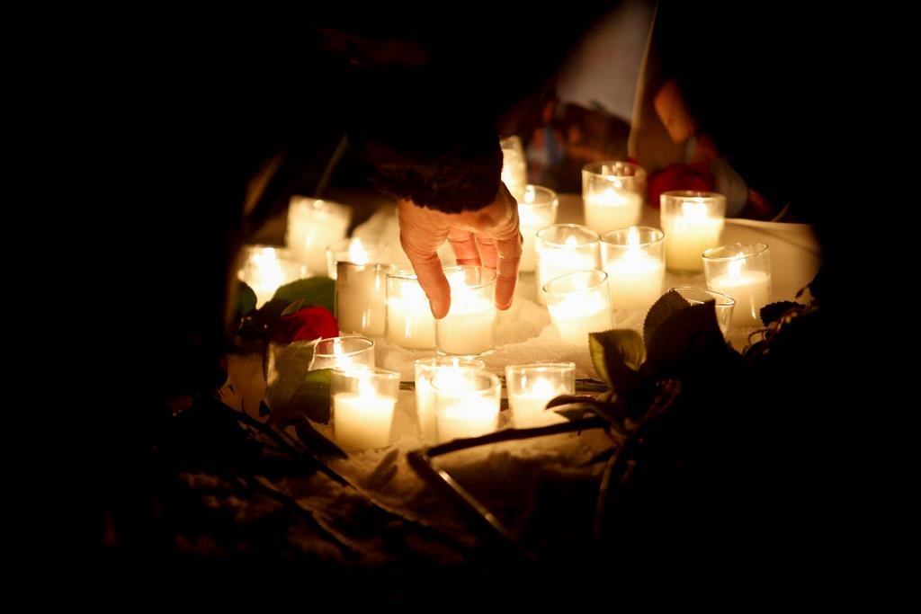 Family and friends of murdered women gather at a vigil in Winnipeg, Thursday, December 1, 2022. Jury selection is set to start today for the trial of a Winnipeg man accused of killing four women. 