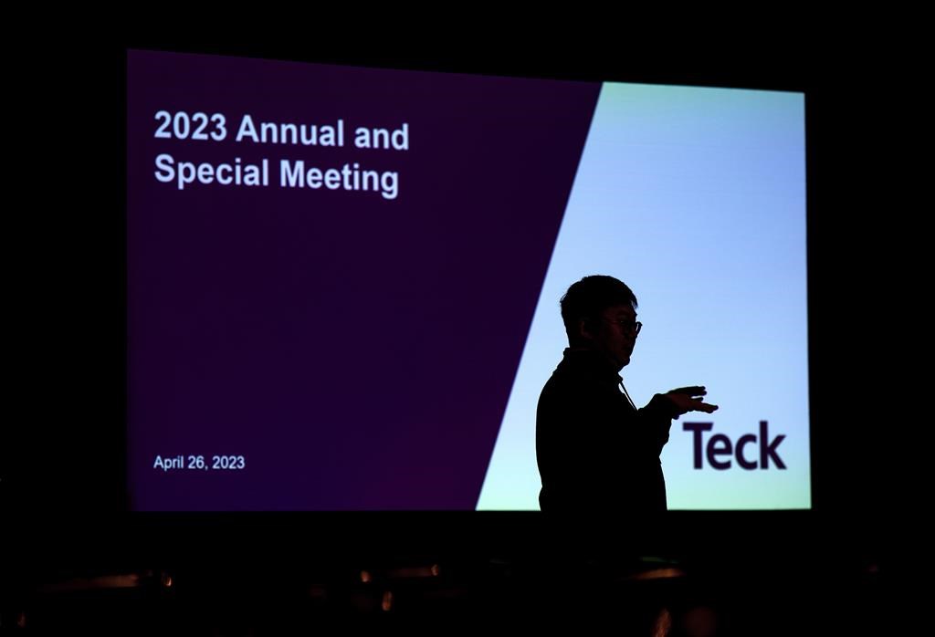 A journalist is silhouetted before the Teck Resources special meeting of shareholders, in Vancouver, B.C., on April 26, 2023. Teck Resources Ltd. reported its first-quarter profit fell compared with a year ago due in part to its reduced ownership in its steelmaking coal business as well as lower copper and zinc prices and higher costs. THE CANADIAN PRESS/Darryl Dyck.