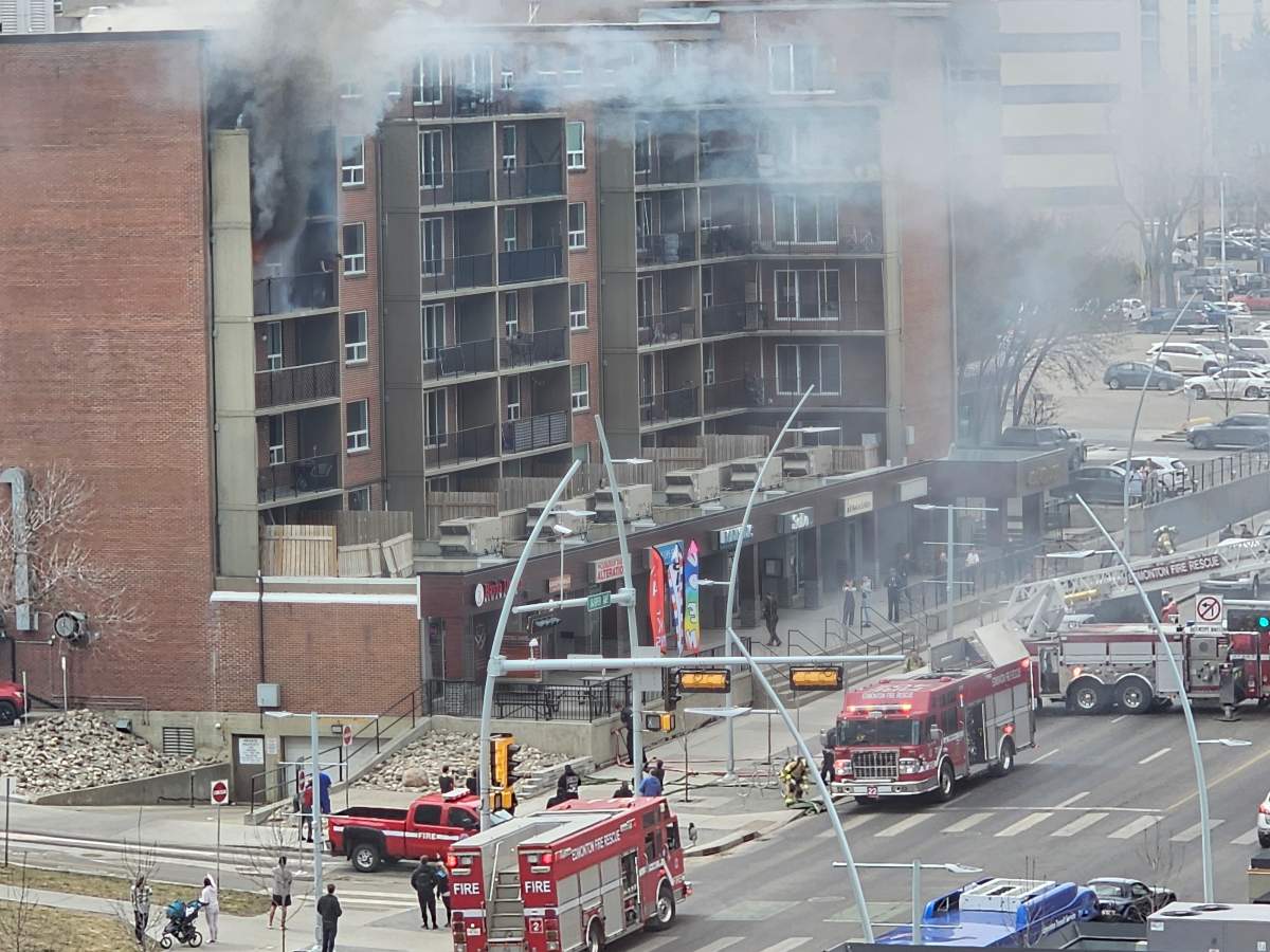 A person was rescued from a fiery balcony as fire crews battled a blaze at an apartment building in the area of Jasper Avenue and 110th Street in Edmonton Thursday, April 25, 2024.