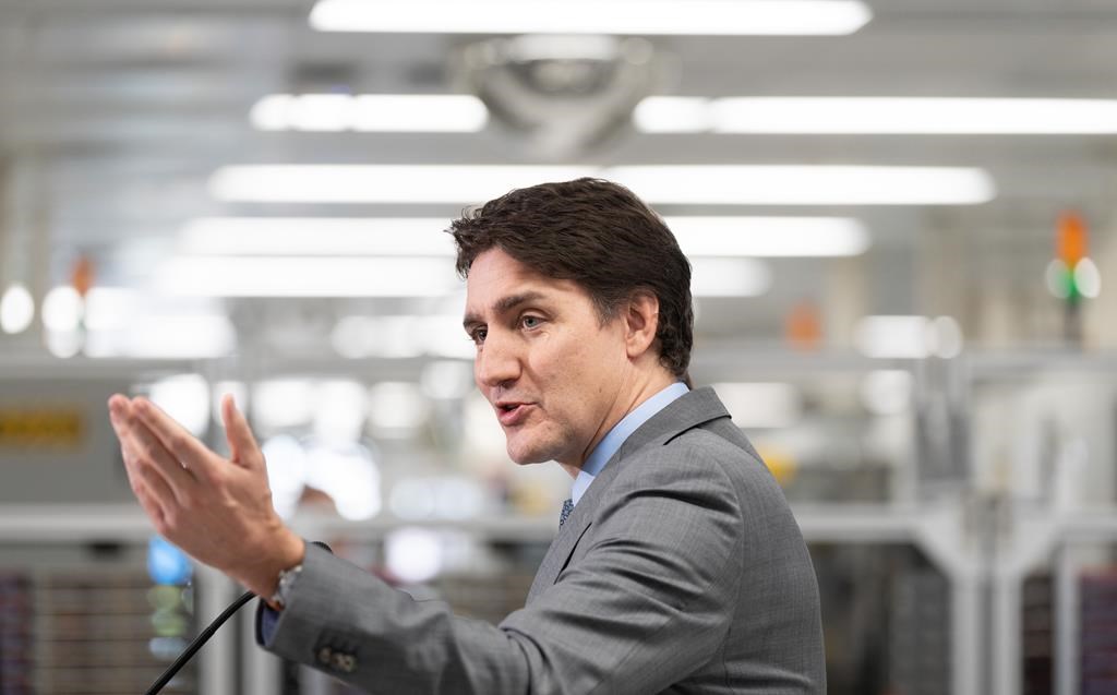 Prime Minister Justin Trudeau speaks to the media following a tour at IBM in Bromont, Que., Friday, April 26, 2024. The federal government is announcing an investment of nearly $60 million in semiconductors, a technology omnipresent in electronic devices, also used to develop artificial intelligence. THE CANADIAN PRESS/Christinne Muschi.