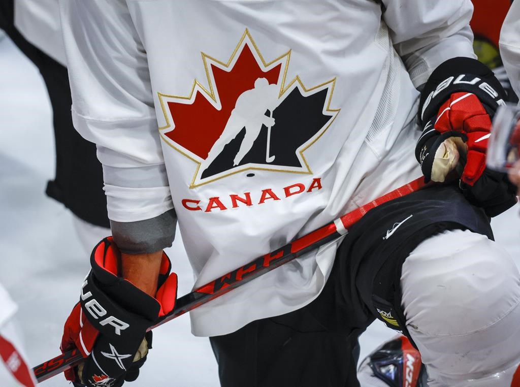 A Hockey Canada logo is shown on the jersey of a player with Canada’s National Junior Team during a training camp practice in Calgary, Tuesday, Aug. 2, 2022.