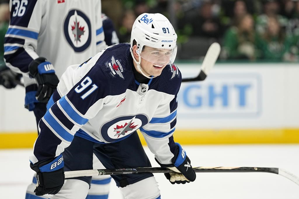 Winnipeg Jets center Cole Perfetti (91) watches a face off during an NHL hockey game against the Dallas Stars in Dallas on February 29, 2024.