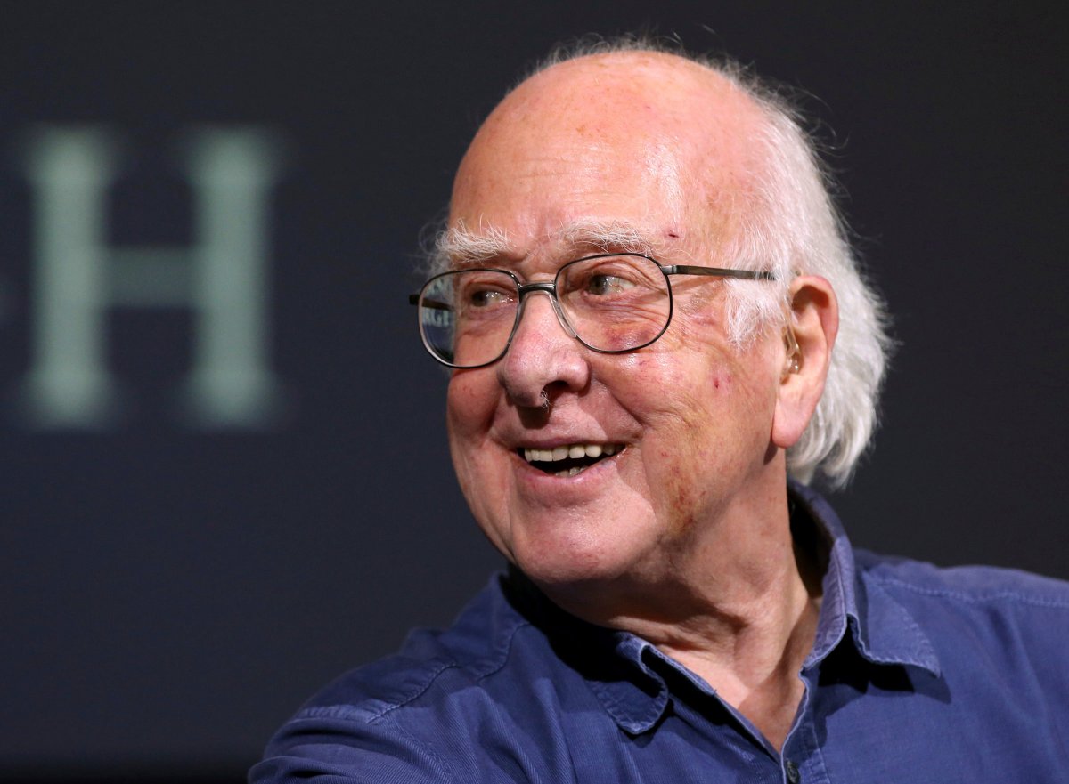 British physicist Peter Higgs smiles during a press conference in Edinburgh, Scotland, on Oct. 11, 2013. The University of Edinburgh says Nobel prize-winning physicist Peter Higgs, who proposed the existence of the Higgs boson particle, has died at 94. Higgs predicted the existence of a new particle — the so-called Higgs boson  — in 1964. But it would be almost 50 years before the particle’s existence could be confirmed at the Large Hadron Collider.