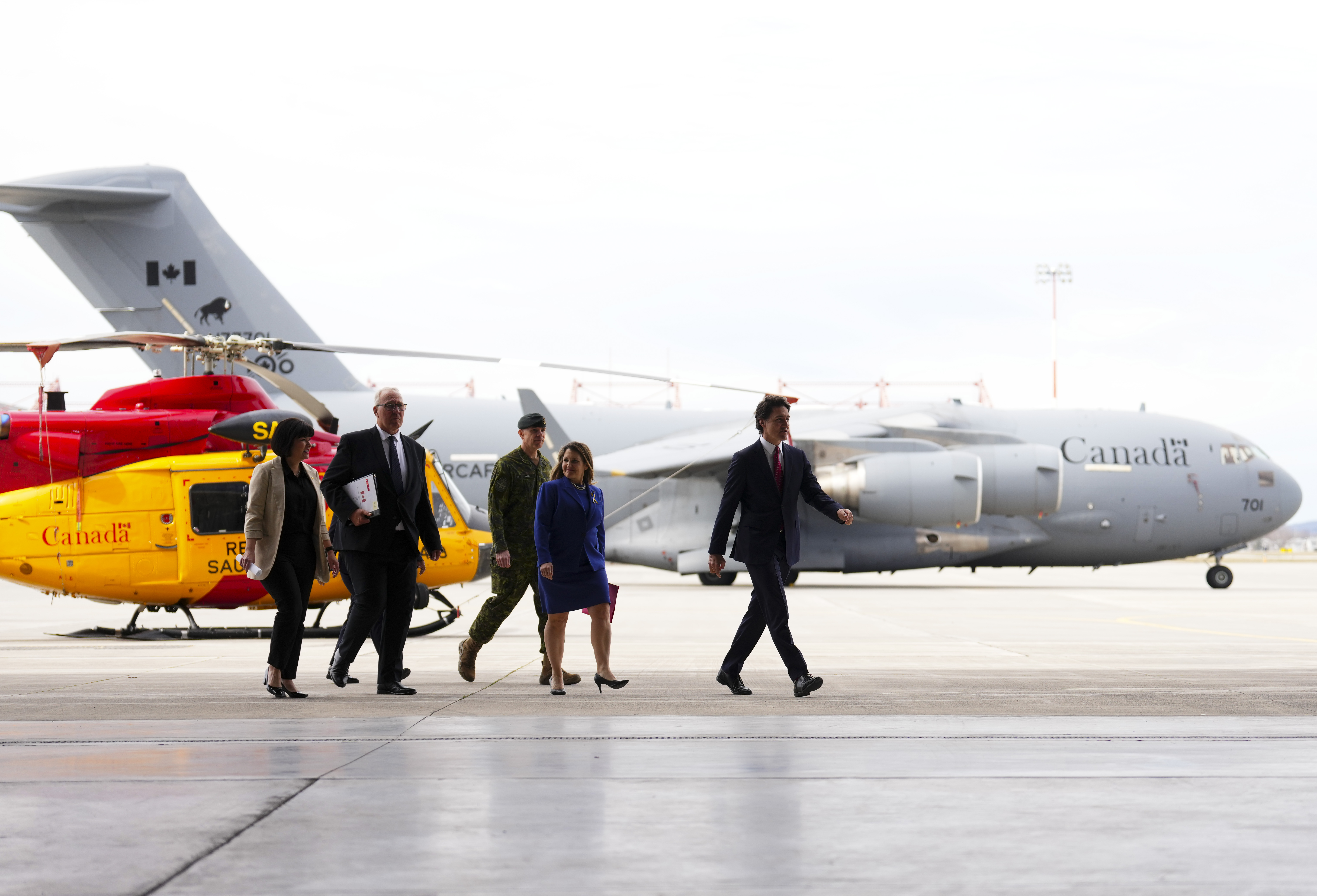 Prime Minister Justin Trudeau, right to left, arrives with Deputy Prime Minister and Minister of Finance Chrystia Freeland, Chief of Defence Staff Gen. Wayne Eyre, National Defence Minister Bill Blair and Minister of Veterans Affairs and Associate Minister of National Defence Ginette Petitpas Taylor for a press conference regarding Canada's new defence policy at CFB Trenton on Monday, April 8, 2024.