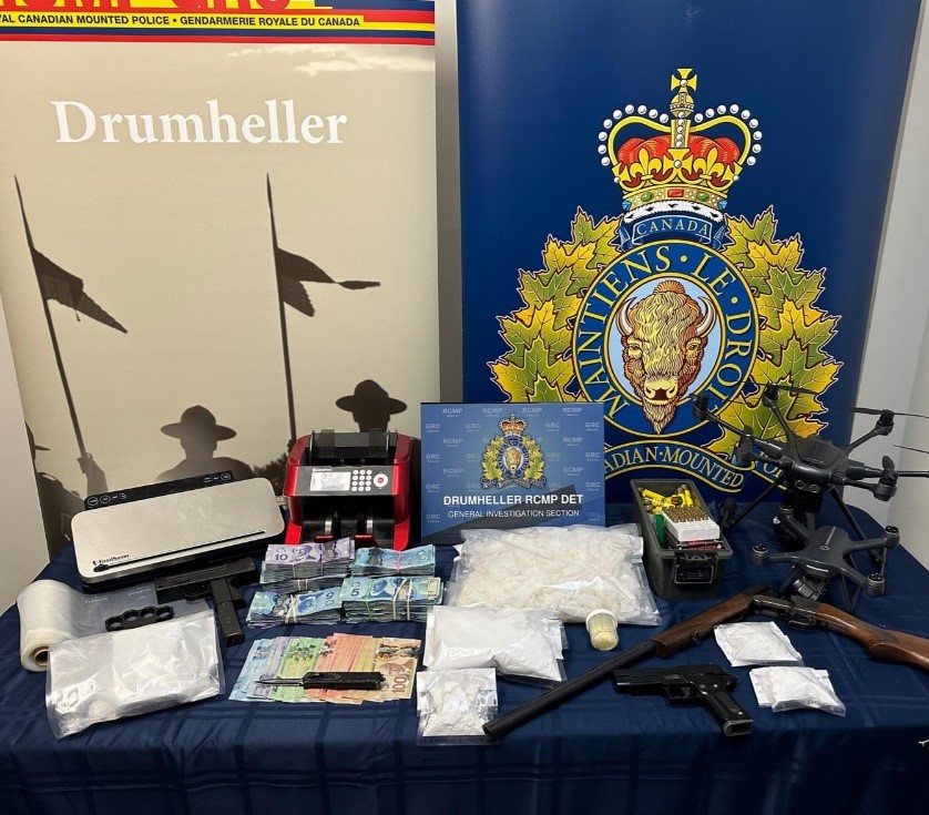 Drugs, money, weapons and a drone seized by Drumheller RCMP.