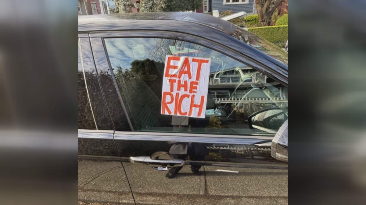 An "Eat the Rich" letter was left on a window that had its tires deflated, according to a resident.