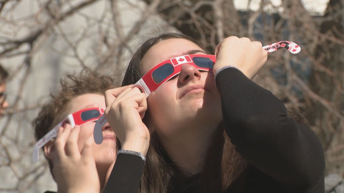 People gathered at the Saskatchewan Science Center to check out the solar eclipse on April. 8, 2024.