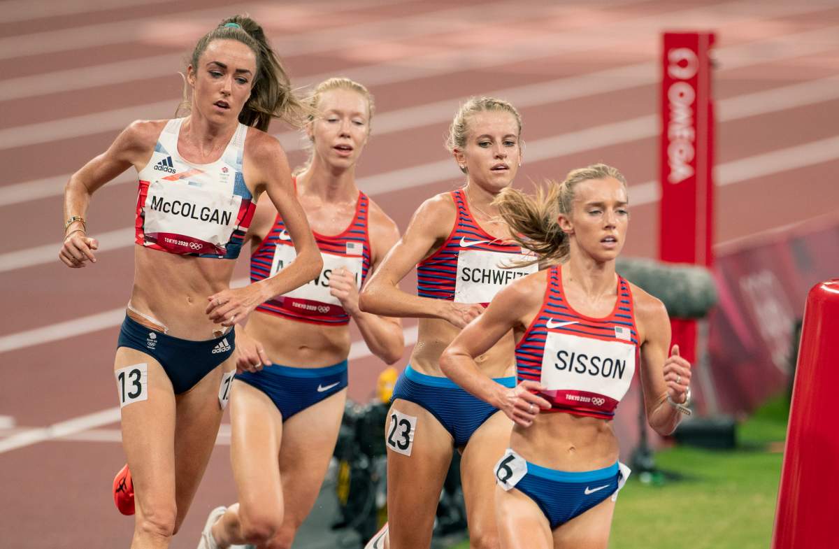 United States runners Emily Sisson, Karissa Schweizer and Alicia Monson along with Eilish McGolgan of Great Britain wearing buns as they race to the finish of the 10000m final for women during the Track and Field competition at the Olympic Stadium at the Tokyo 2020 Summer Olympic Games on August 7th, 2021.