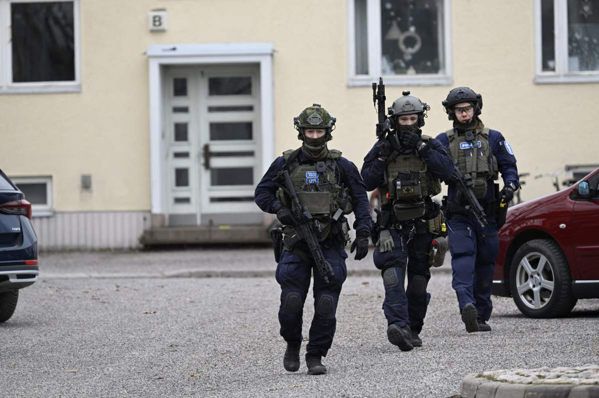 Heavily armed Finnish police at the scene of a shooting at the Viertola school.