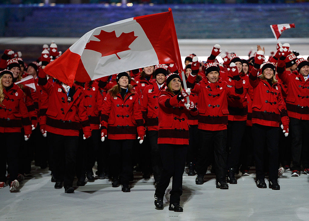 Ice hockey player Hayley Wickenheiser of the Canada Olympic team carries her country's flag during the Opening Ceremony of the Sochi 2014 Winter Olympics at Fisht Olympic Stadium on February 7, 2014 in Sochi, Russia.