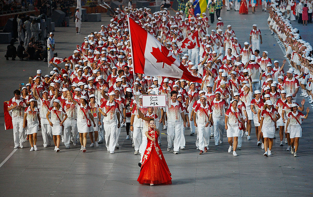 Adam Van Koeverden of the Canada Olympic team carries his country's flag to lead out the delegation during the Opening Ceremony for the 2008 Beijing Summer Olympics at the National Stadium on August 8, 2008 in Beijing, China.