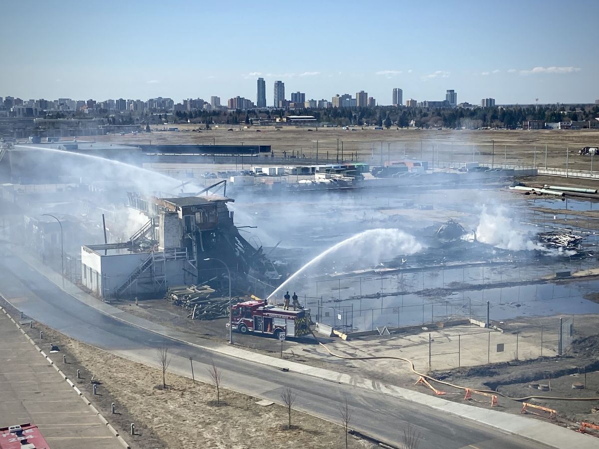 A view of Hangar 11 in Edmonton at noon on April 23, 2024, the day after a massive fire. The structure is situated between the NAIT campus and the Blatchford neighbourhood, alongside what used to be Edmonton's City Centre Airport.