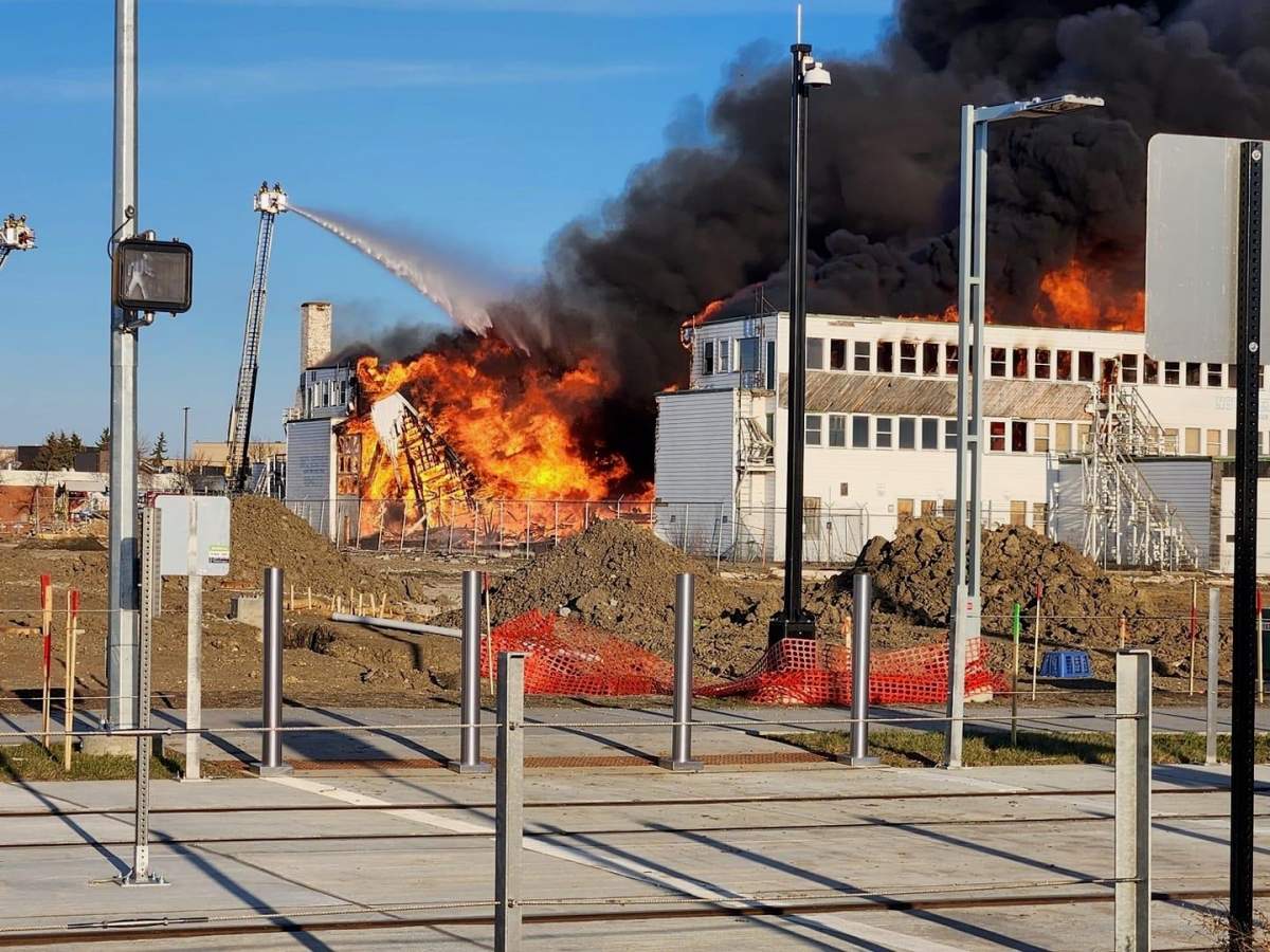 A large fire broke out at an old municipal airport hangar between the NAIT campus and Blatchford in central Edmonton on Monday, April 22, 2024.