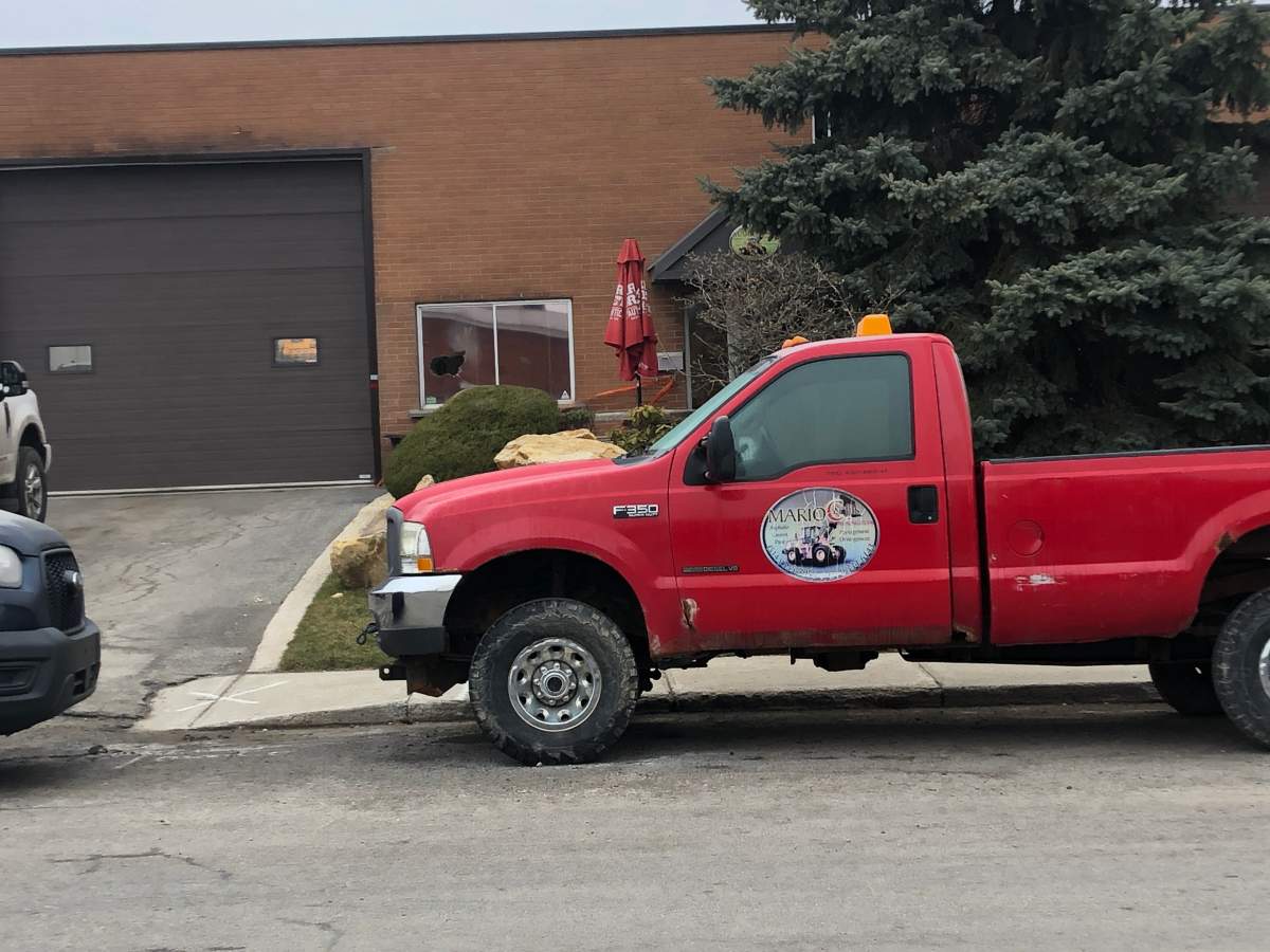 A window is left shattered as police investigate an act of arson. 