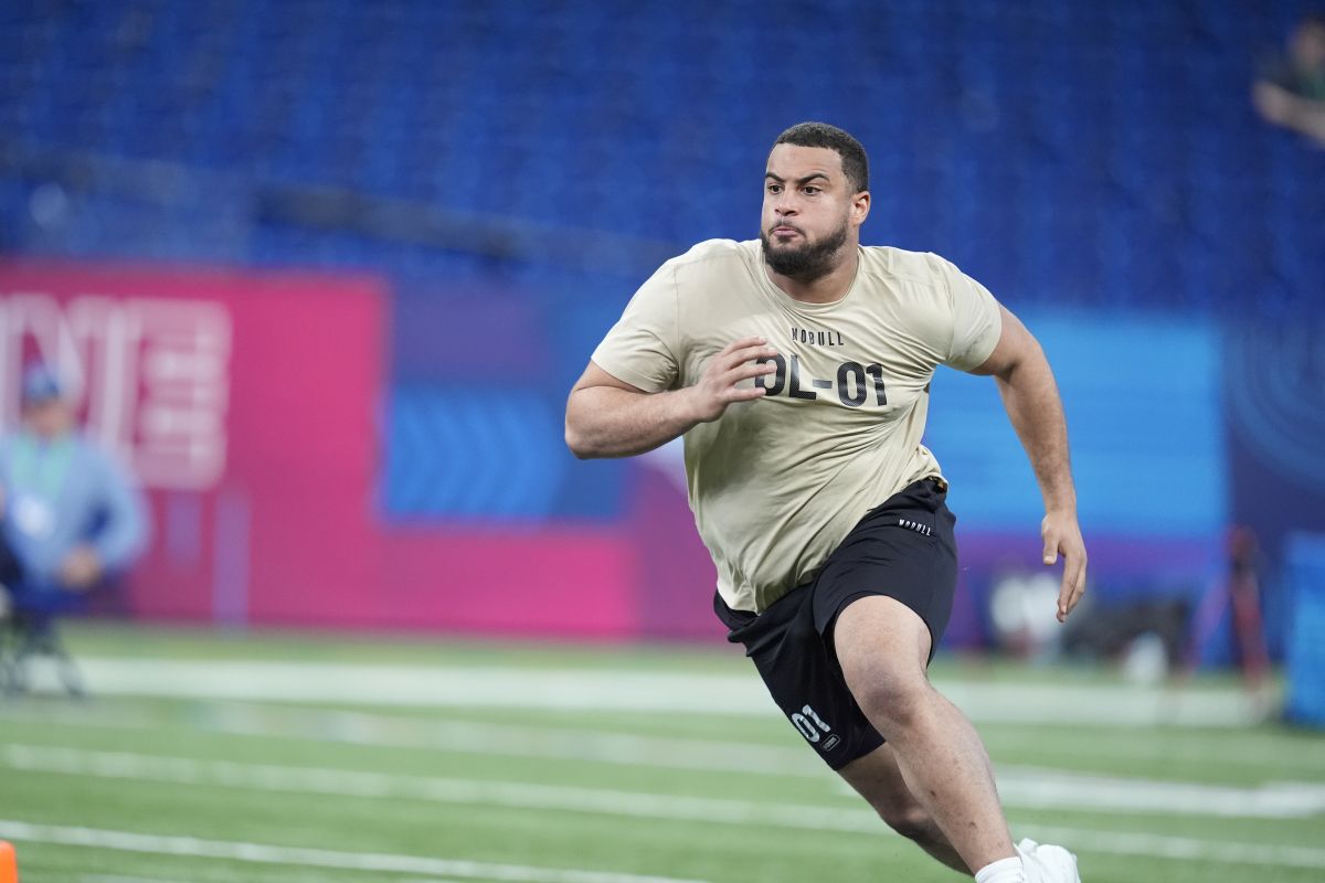 Illinois offensive lineman Isaiah Adams runs a drill at the NFL football scouting combine, Sunday, March 3, 2024, in Indianapolis.