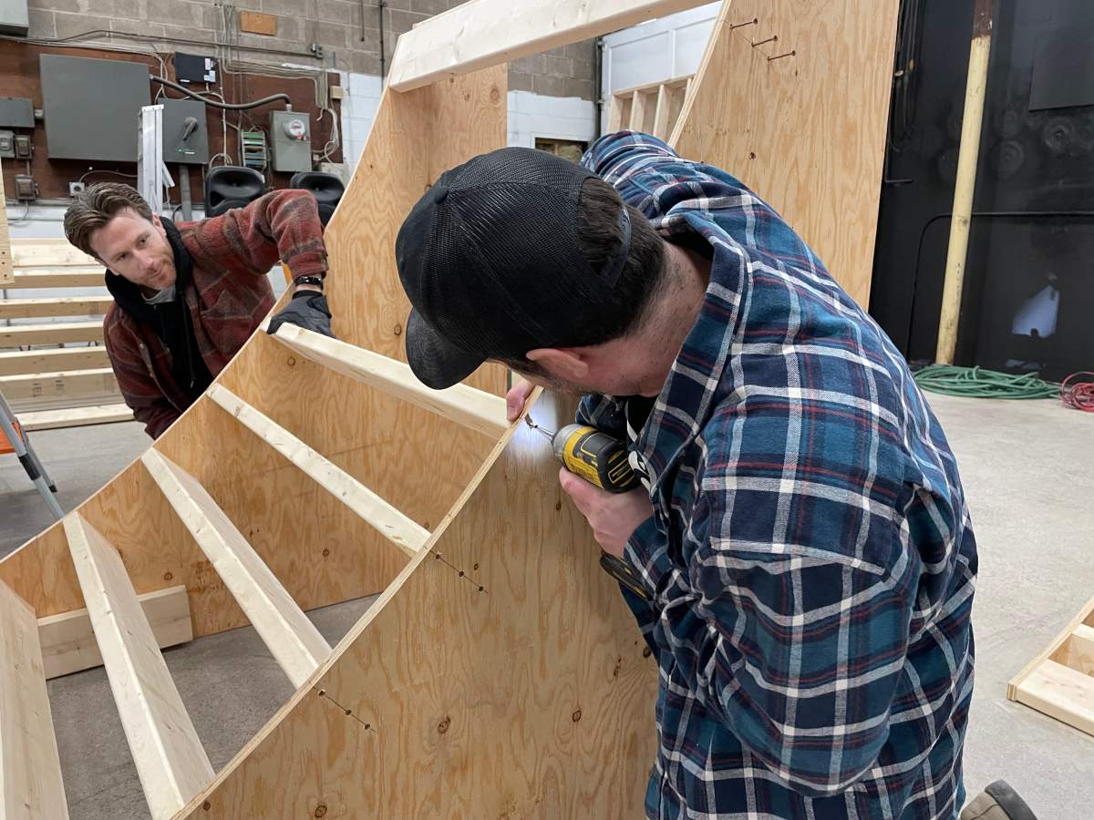 Parker and Morrison work on building a ramp for their soon-to-be-opened indoor skate park.
