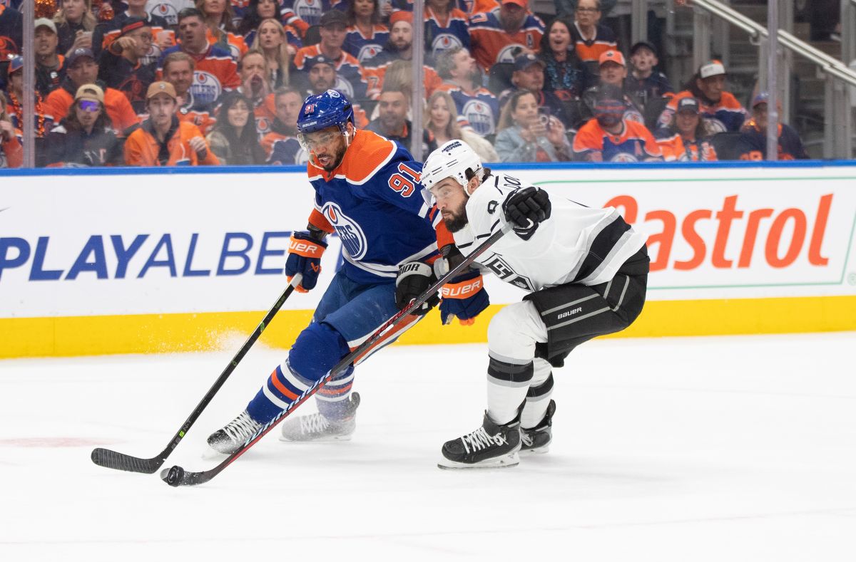 Los Angeles Kings' Drew Doughty (8) and Edmonton Oilers' Evander Kane (91) battle for the puck during second period NHL Stanley Cup first round playoff action in Edmonton on Tuesday, April 25, 2023.