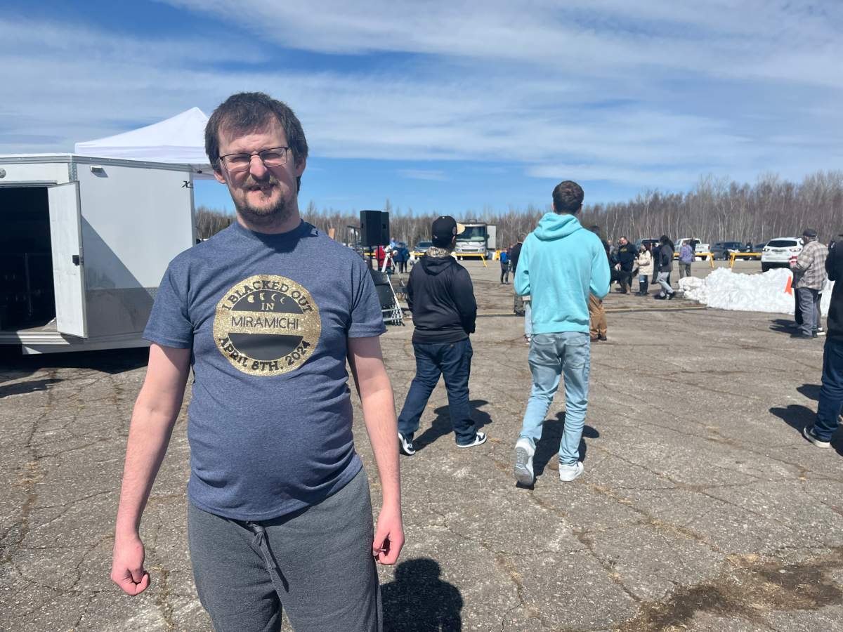 TJ Hansen proudly wears his custom eclipse T-shirt made by his girlfriend.