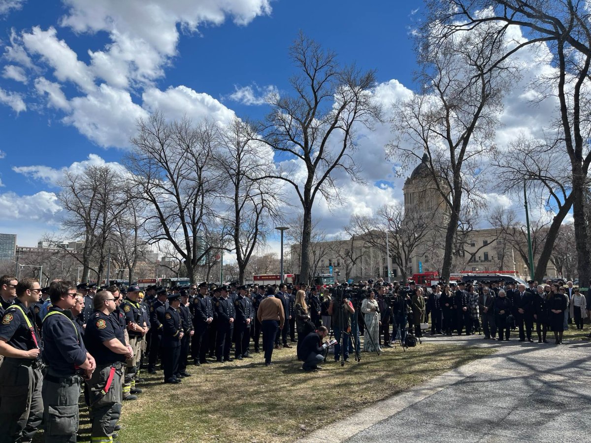 Firefighters and other first responders gather in front of the Manitoba legislature April 22. 