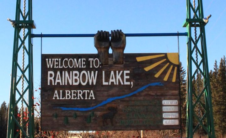 A photo of a sign for the town of Rainbow Lake in northern Alberta.