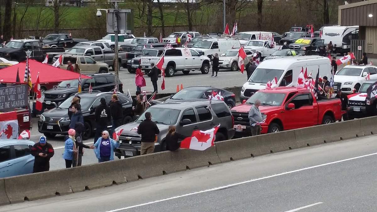 Protesters against the carbon price gather along Highway 1 near Hope, B.C. on April 1, 2024.
