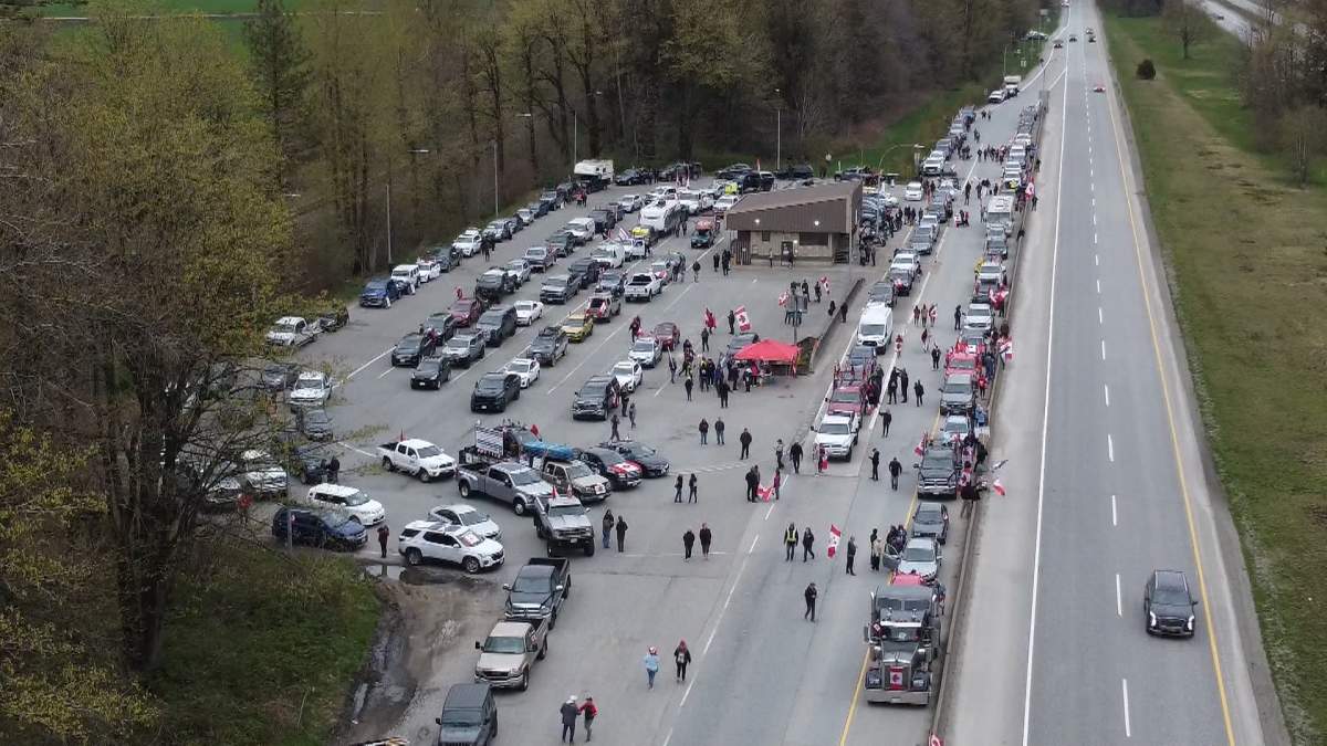 Protesters against the carbon price gather along Highway 1 near Hope, B.C. on April 1, 2024.