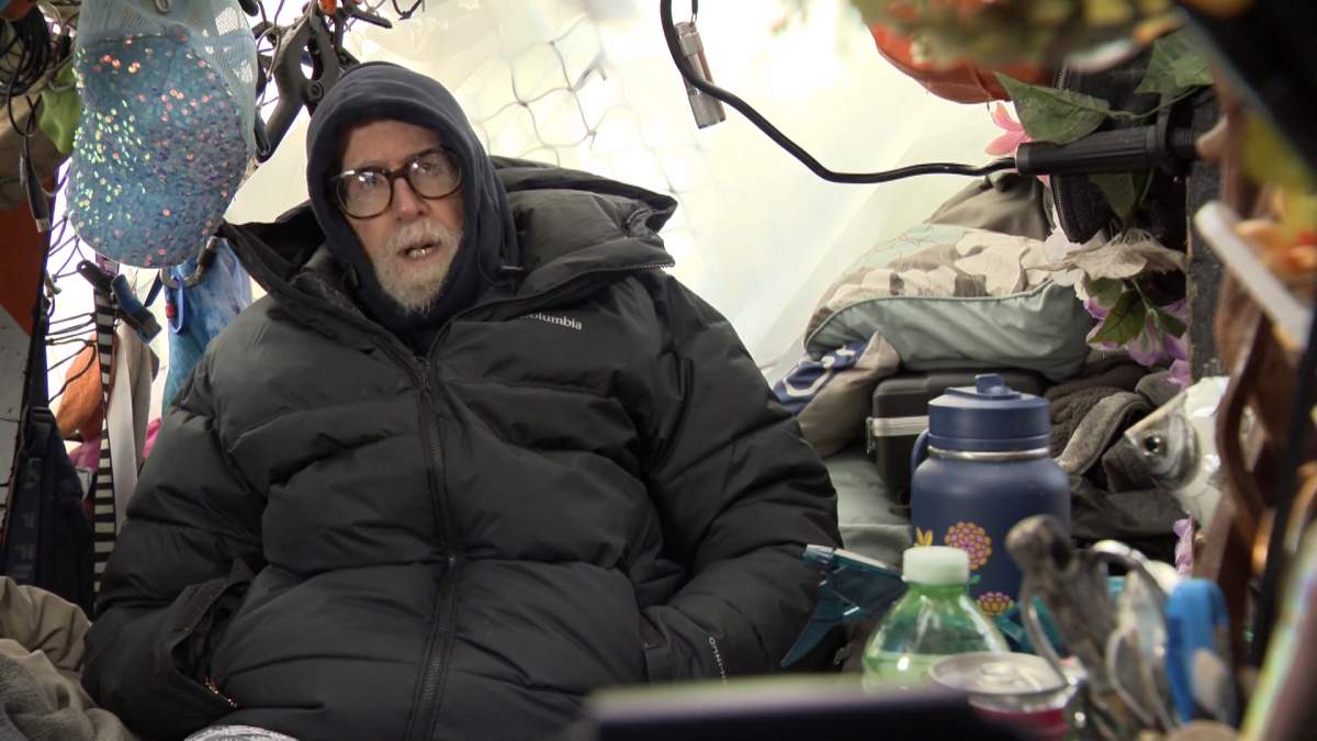 Christenson Bailey inside his tent in Vancouver's Stanley Park.