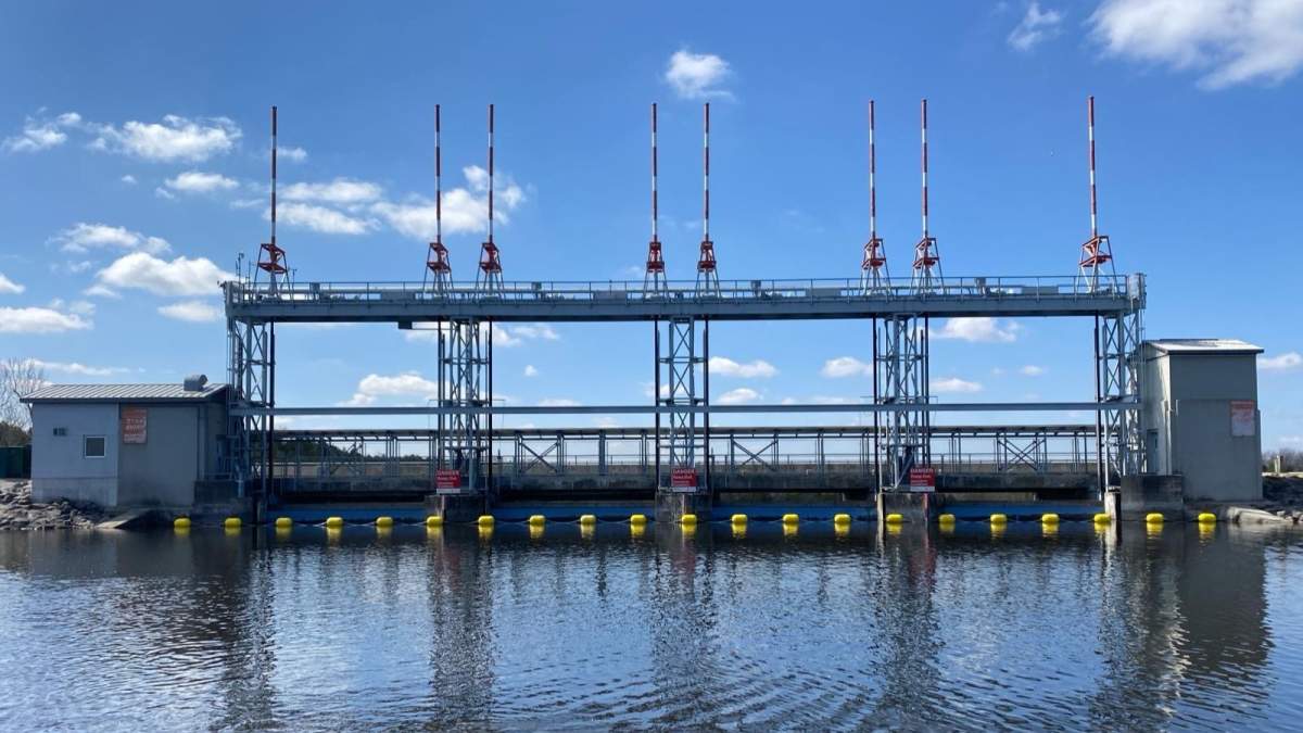A yellow warning boom is place in front of Shand Dam in Centre Wellington.