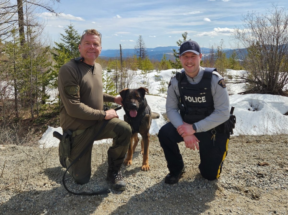 A photo of Cpl. Jason Goodfellow, Police Service Dog Dug and Const. Owen Johansson.
