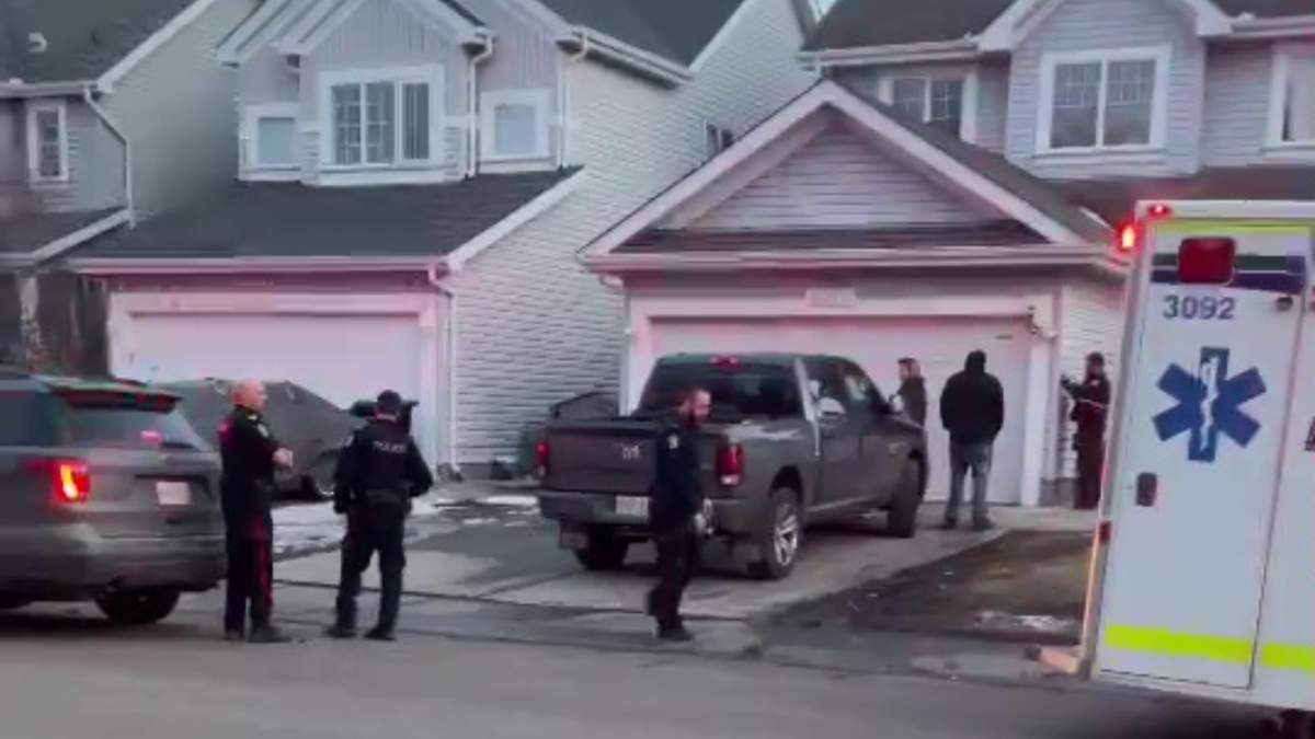 Edmonton first responders at a home near 82 Street and 11 Avenue SW in Summerside, where a child was fatally attacked by dogs on Monday, April 1, 2024.