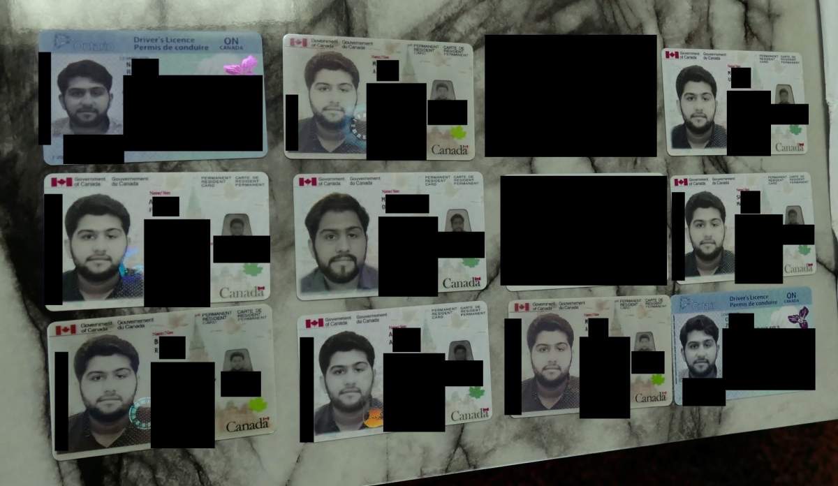 Photo of synthetic identity fraud documents.