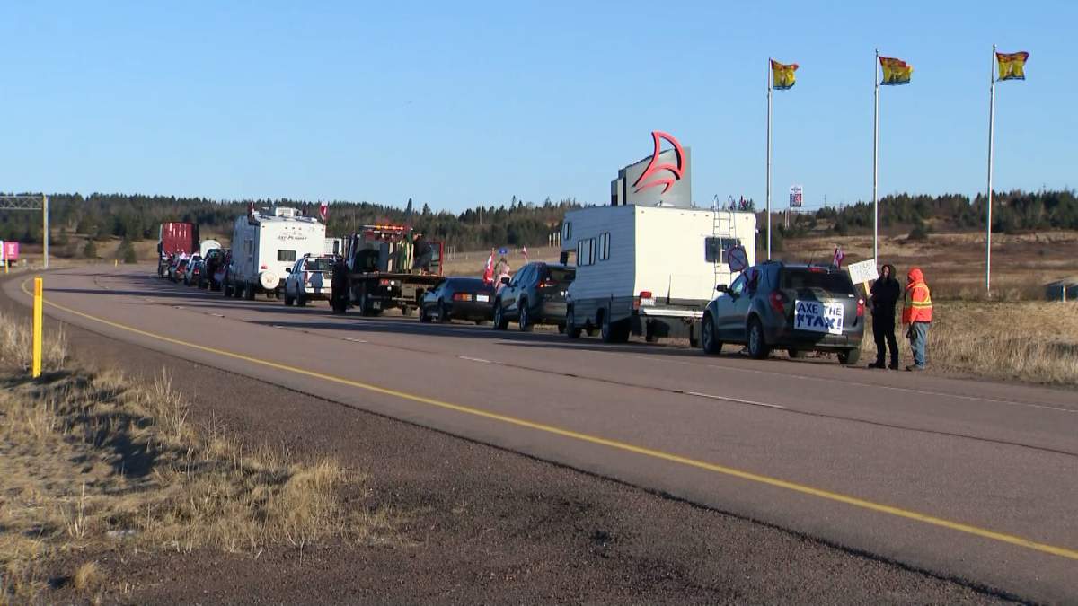 Demonstrators lined the highway in Aulac, N.B., in protest of the federal carbon price increase.