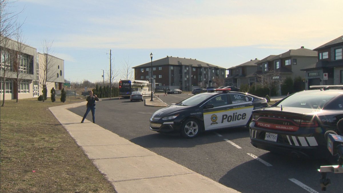 A police care is seen outside a residential building in Candiac, Quebec.