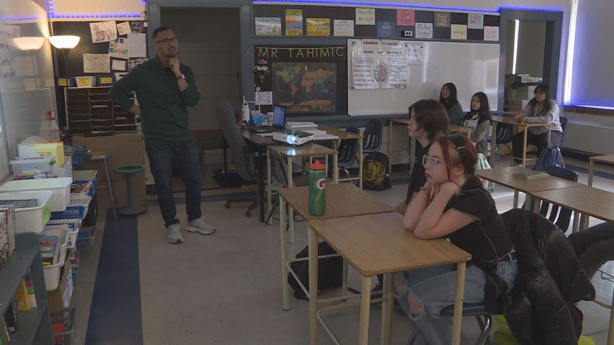 Alex Tahimic teaches his class of Grade 7 students at Isaac Newton School.